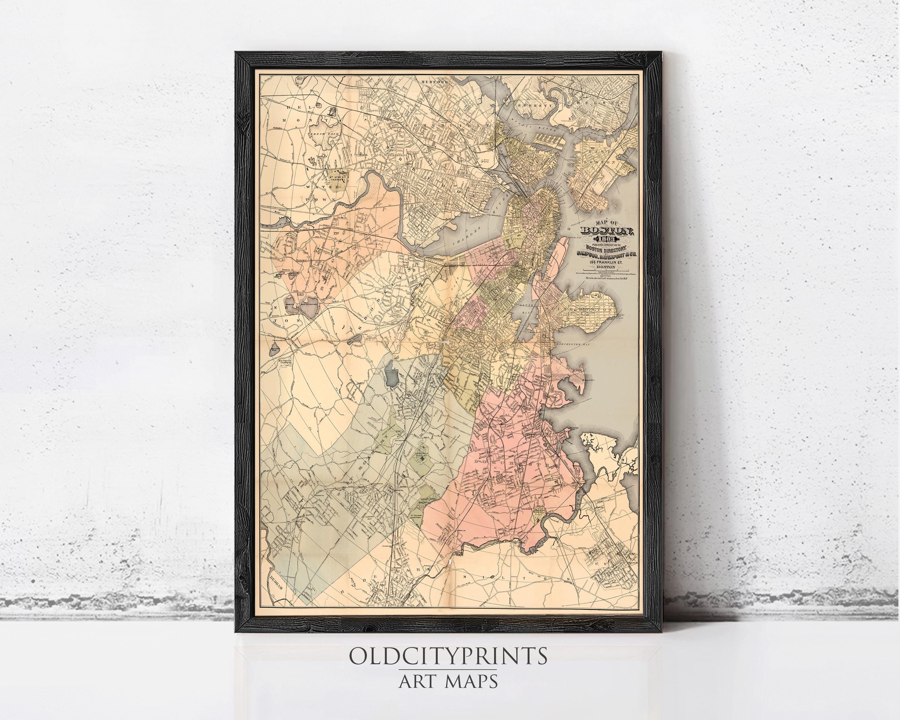 The image is a framed vintage map of Boston, Massachusetts, with a black border and a beige background.