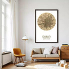 a living room with a large framed map of Dublin hanging on the wall, a wooden chair, a sofa, and a lamp.