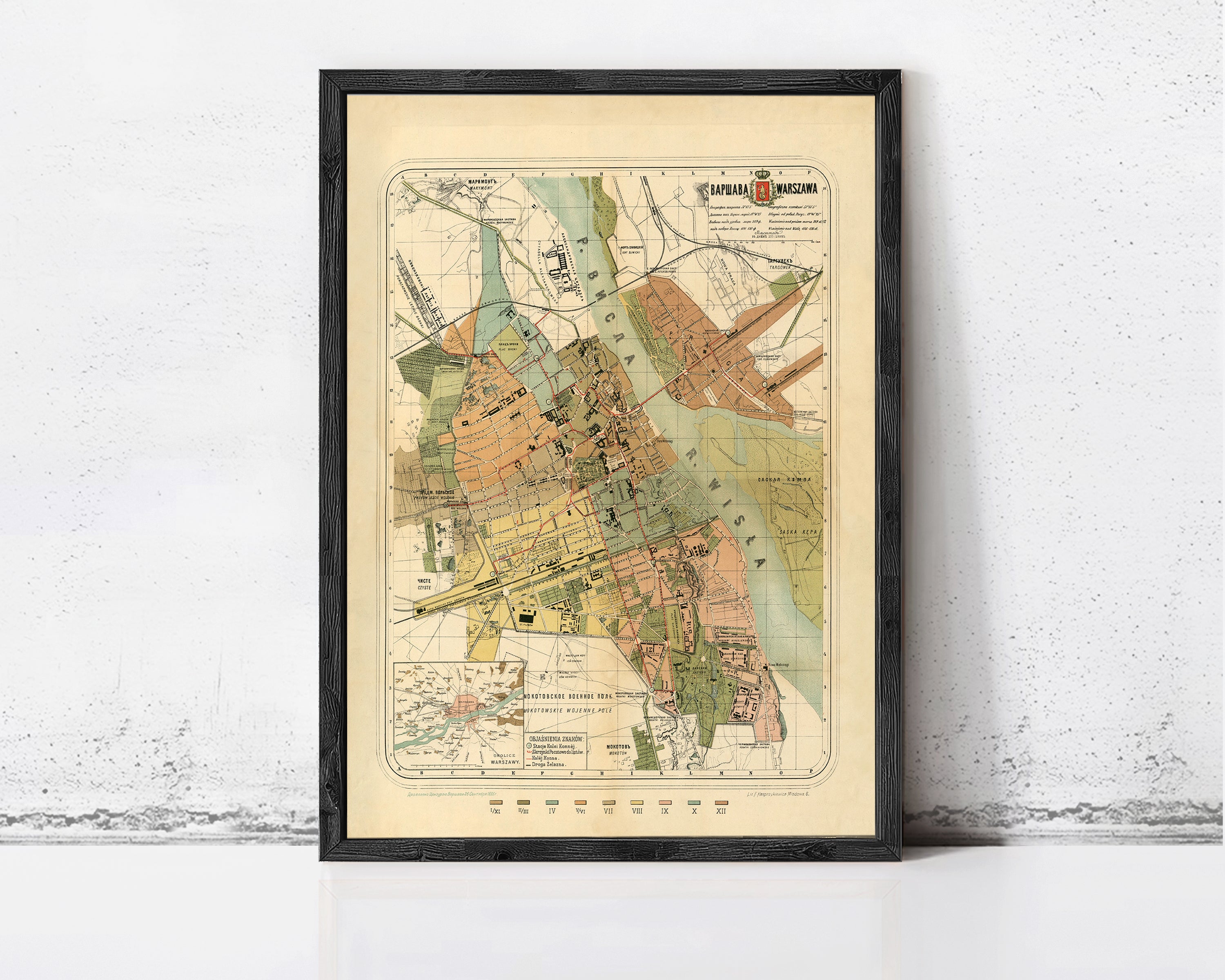The image is a framed vintage map of a city, depicting various landmarks and streets.