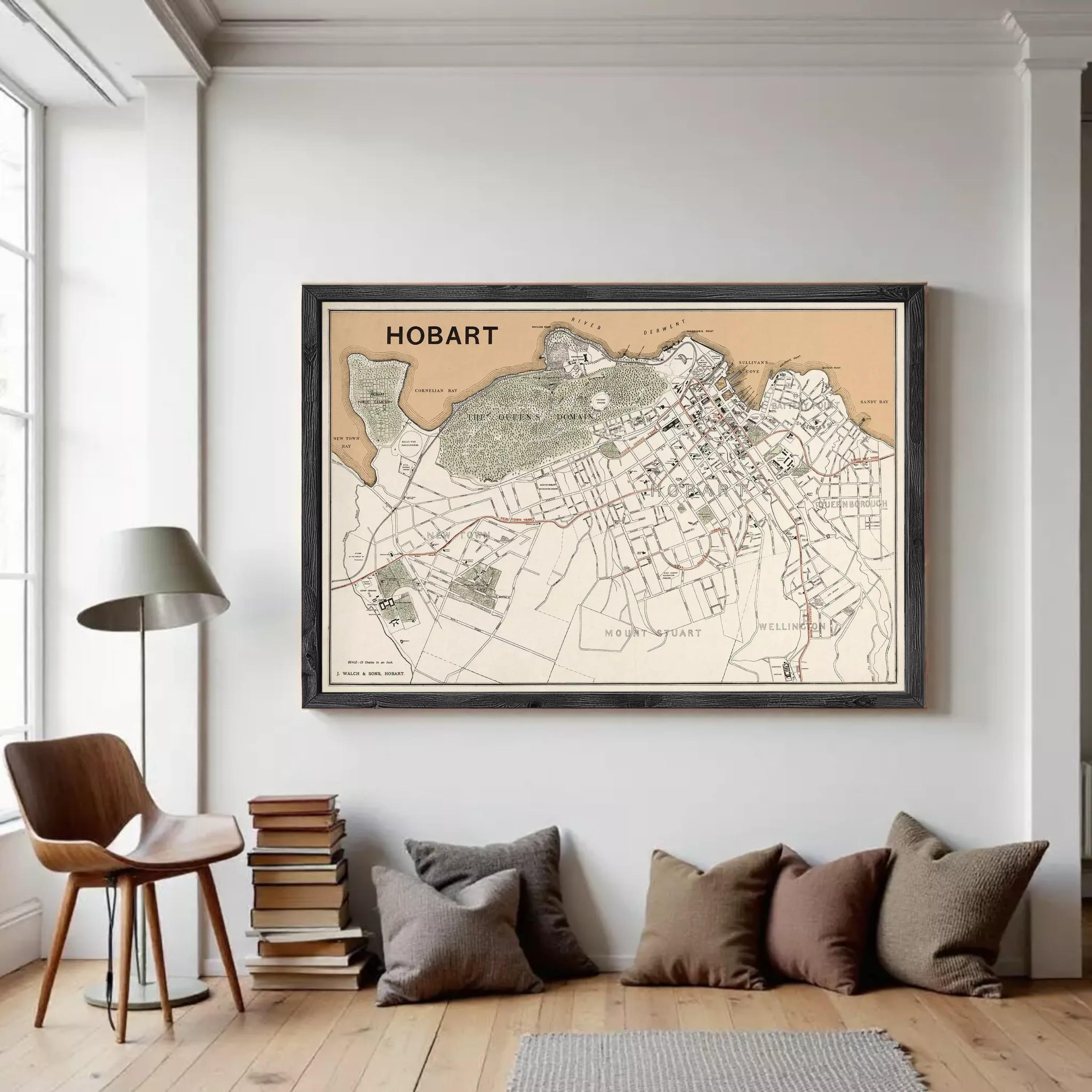 The image is a framed map of Hobart, Australia, showing the city's streets, landmarks, and surrounding areas.
