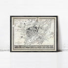 The image is a framed map of a city, likely from the 19th century, with a detailed layout and various landmarks.
