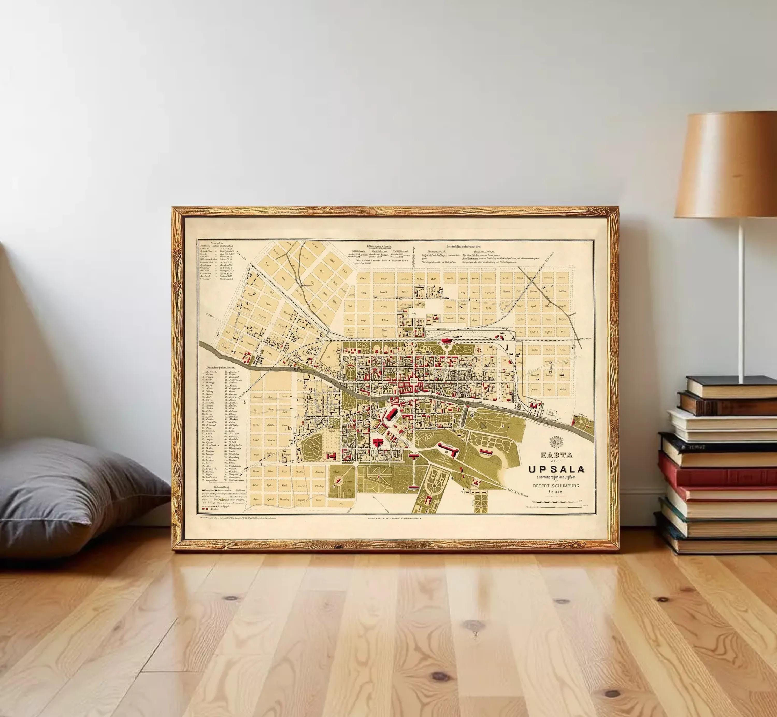 The image is a framed map of the city of Uppsala, Sweden, depicting the layout of the city and surrounding areas.