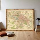 The image is a framed vintage map of a city, likely London, with various streets, landmarks, and neighborhoods depicted.