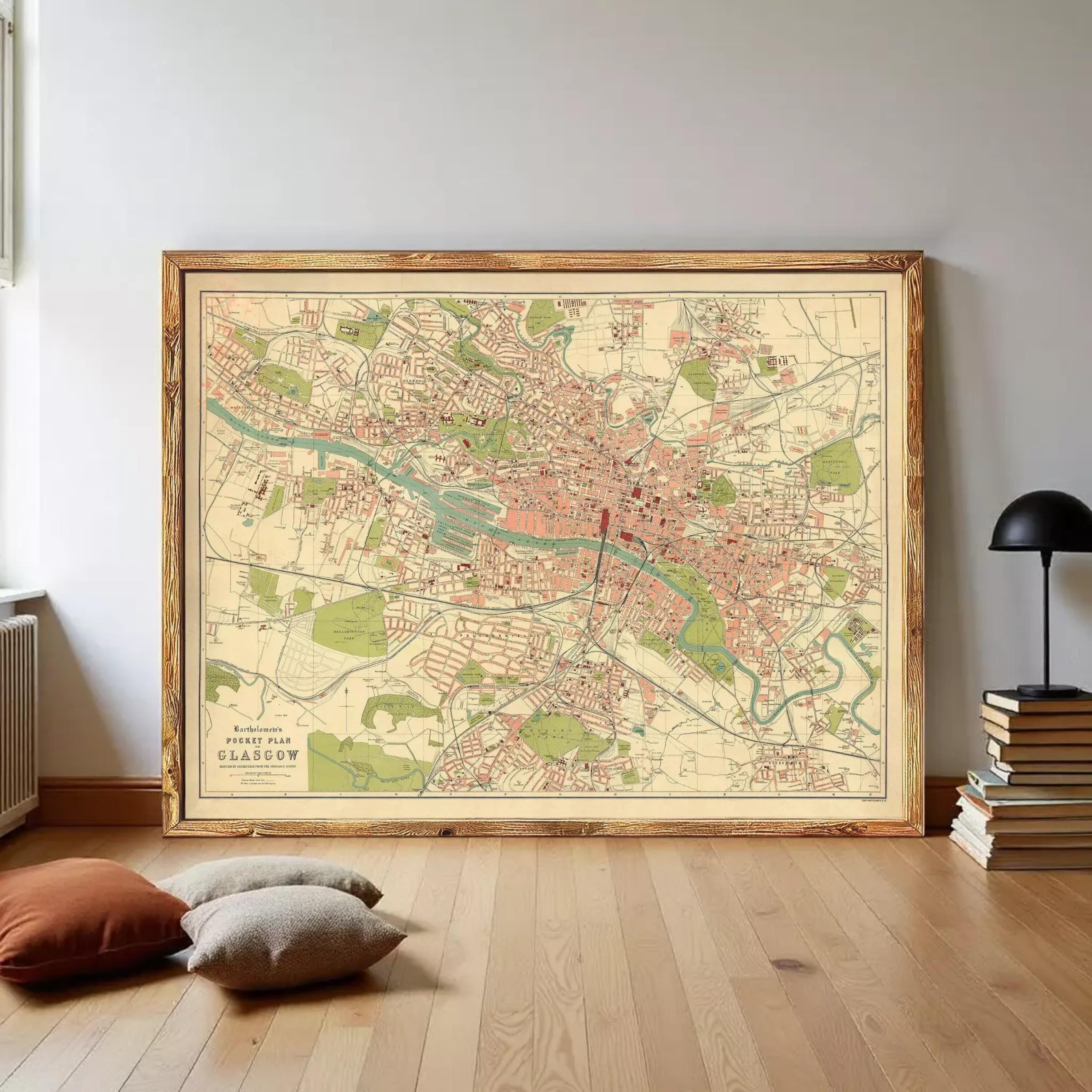 The image is a framed vintage map of a city, likely London, with various streets, landmarks, and neighborhoods depicted.