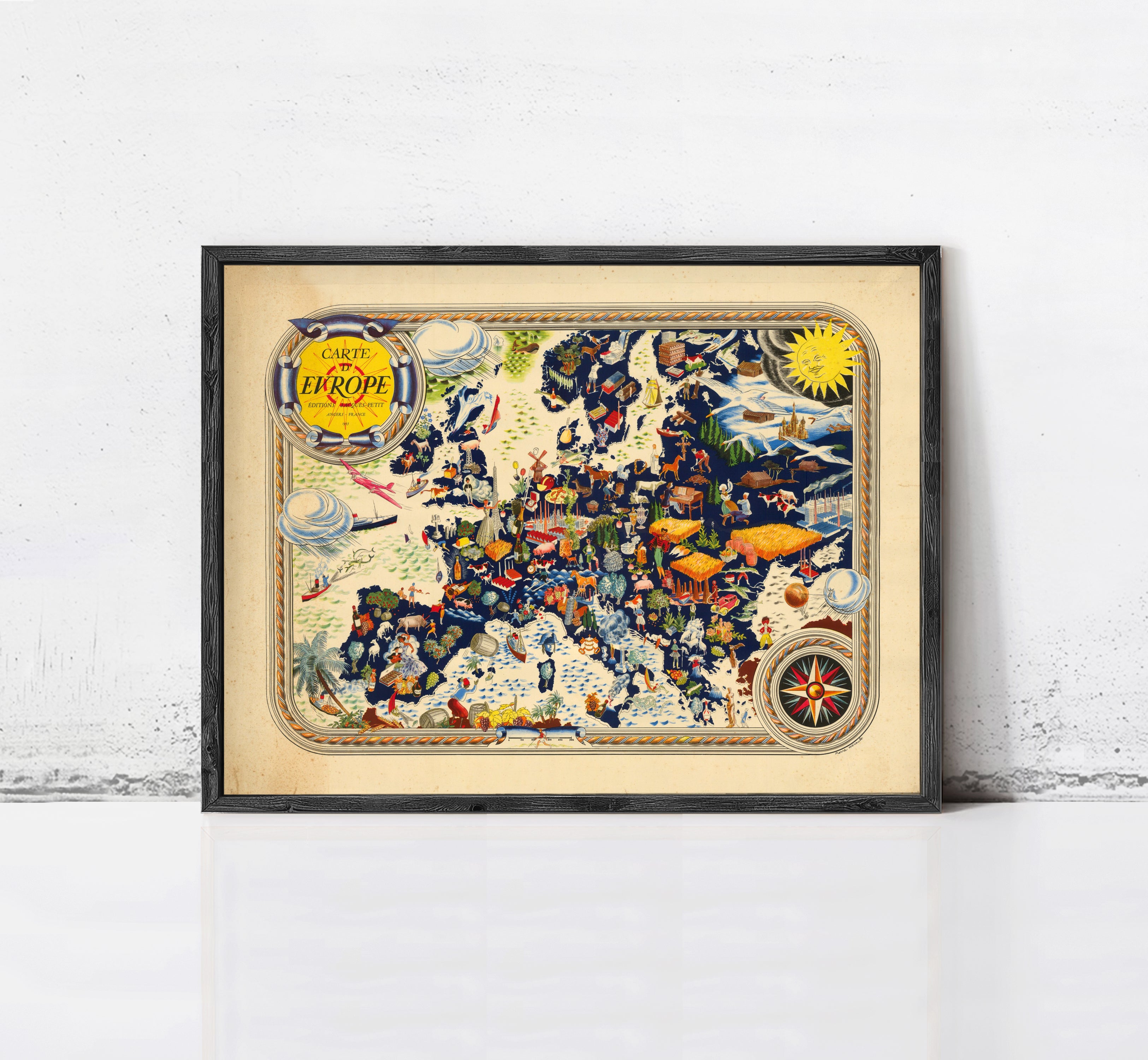 The image is a framed vintage map of Europe, featuring various landmarks, symbols, and illustrations.