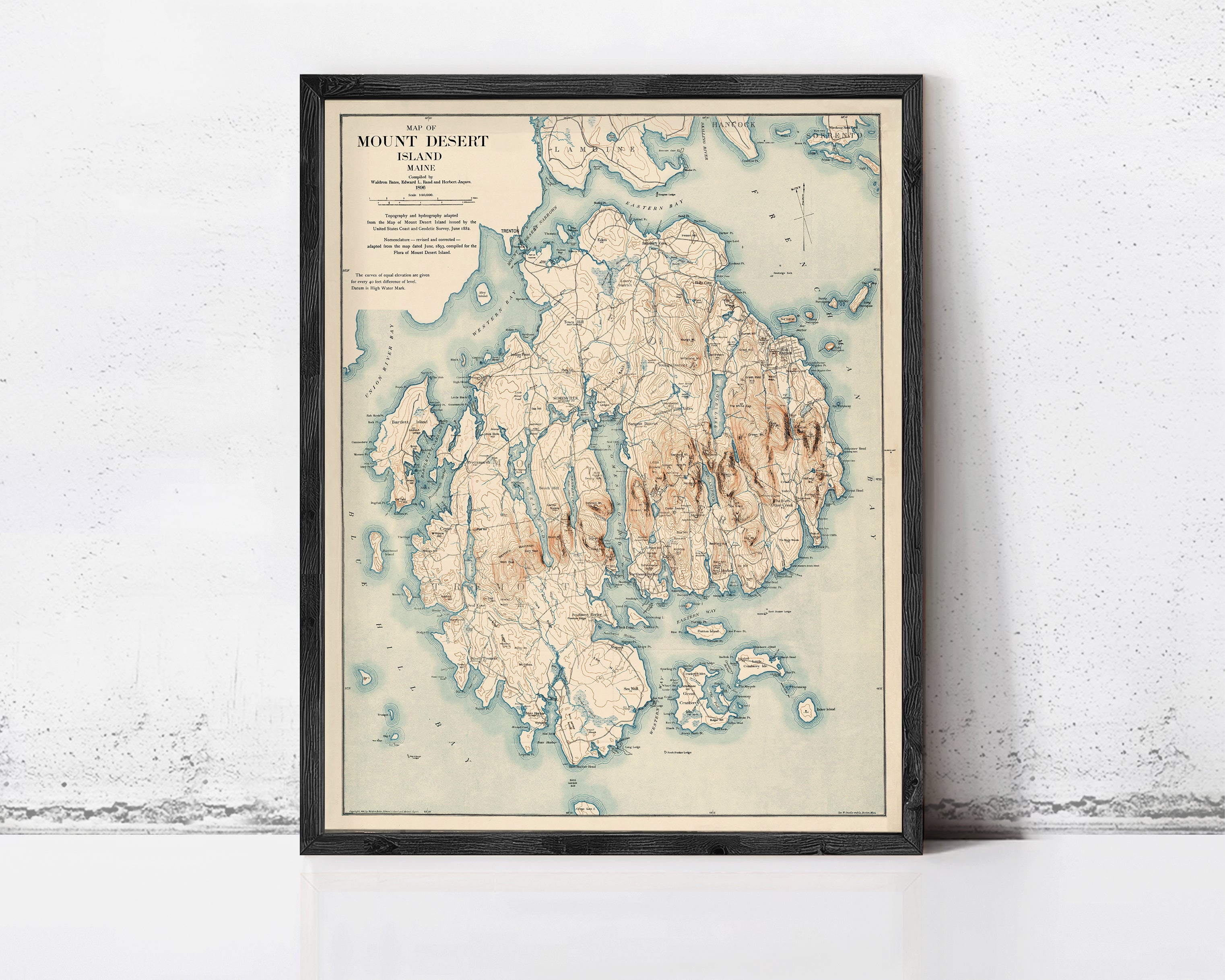 The image is a framed vintage map of Mount Desert Island, Maine, depicting the island's geographical features and surrounding areas.