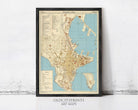 The image is a framed vintage map of an old city, likely from the 19th century, displayed on a wall.