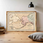 The image is a framed vintage map of Alaska, depicting the state's geographical layout and surrounding areas.