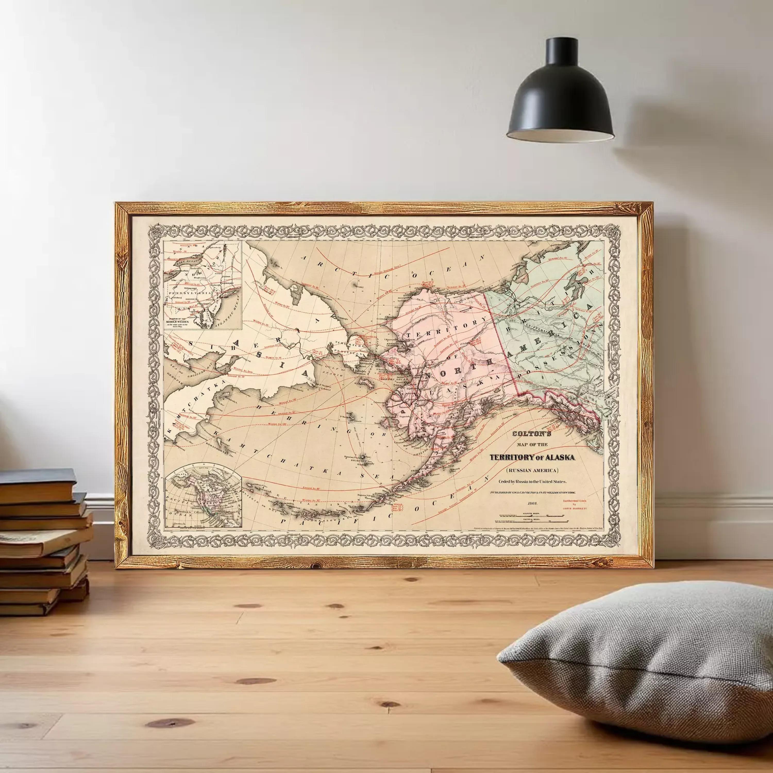 The image is a framed vintage map of Alaska, depicting the state's geographical layout and surrounding areas.