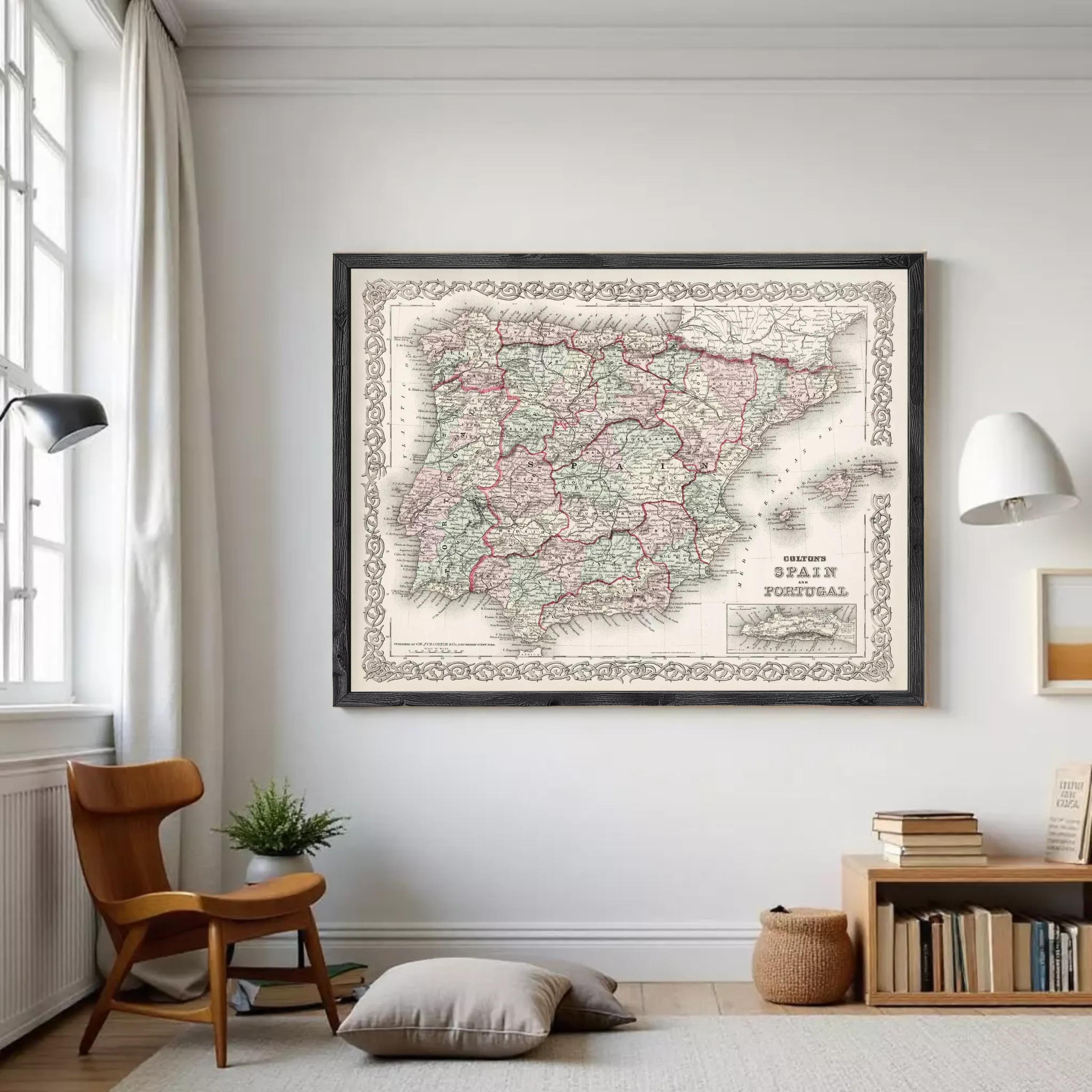 A framed vintage map of Spain and Portugal, with a decorative border around the edges.