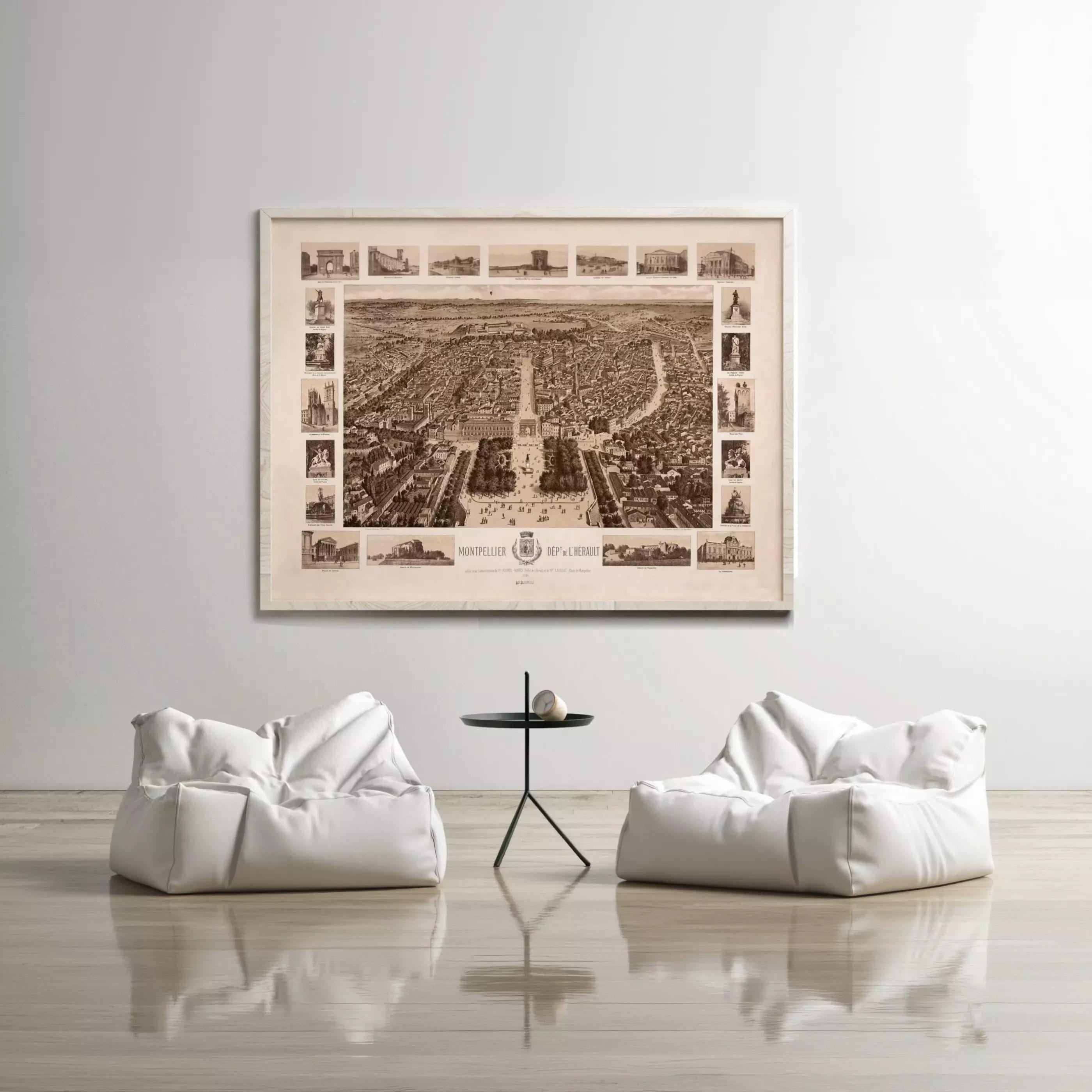 a large framed map of a city hanging on a wall, with two white bean bag chairs positioned in front of it.