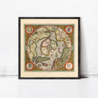 The image is a framed vintage map of the world, depicting the continents and oceans in a detailed and colorful manner.