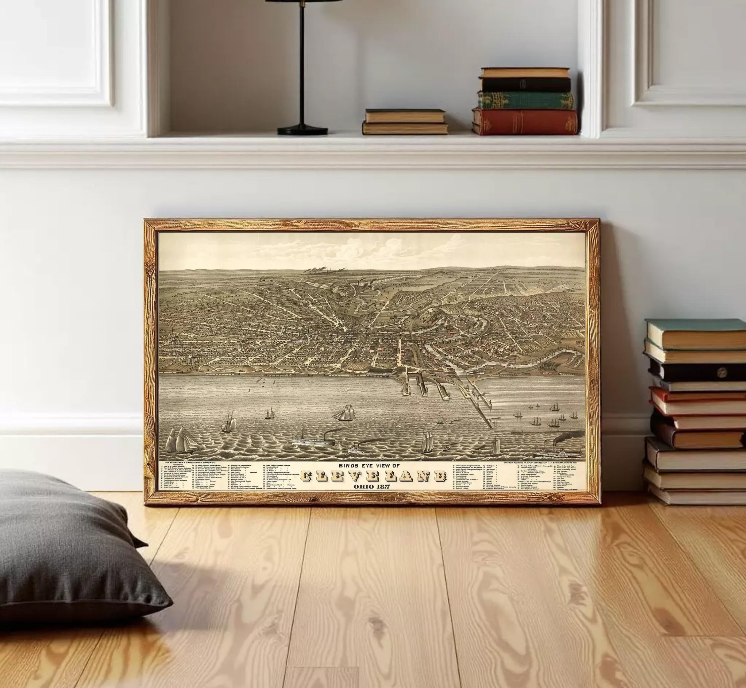 The image is a framed vintage map of Cleveland, Ohio, depicting the city's layout and surrounding areas.