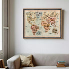a large, colorful world map hanging on a wall above a gray couch.