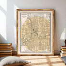 The image is a framed map of Atlanta, Georgia, depicting the city's streets and neighborhoods.