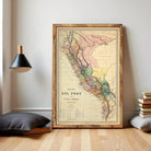 The image is a framed vintage map of South America, specifically the Andes Mountains region, with a wooden frame.