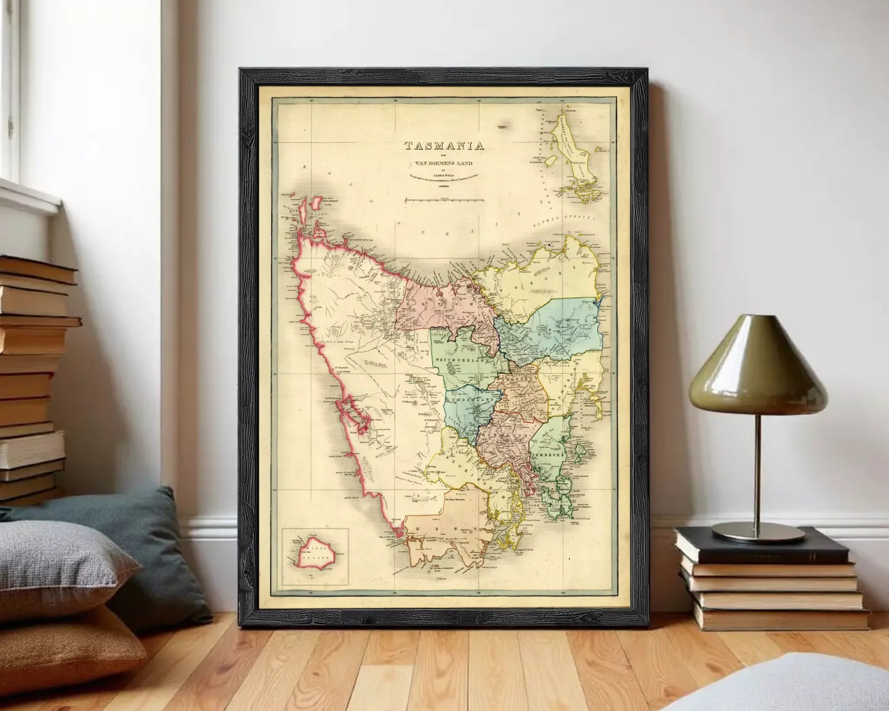 The image is a framed vintage map of Tasmania, Australia, depicting the state's geographical layout and boundaries.