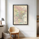 The image is a framed vintage map of Philadelphia, Pennsylvania, depicting the city's streets, neighborhoods, and surrounding areas.
