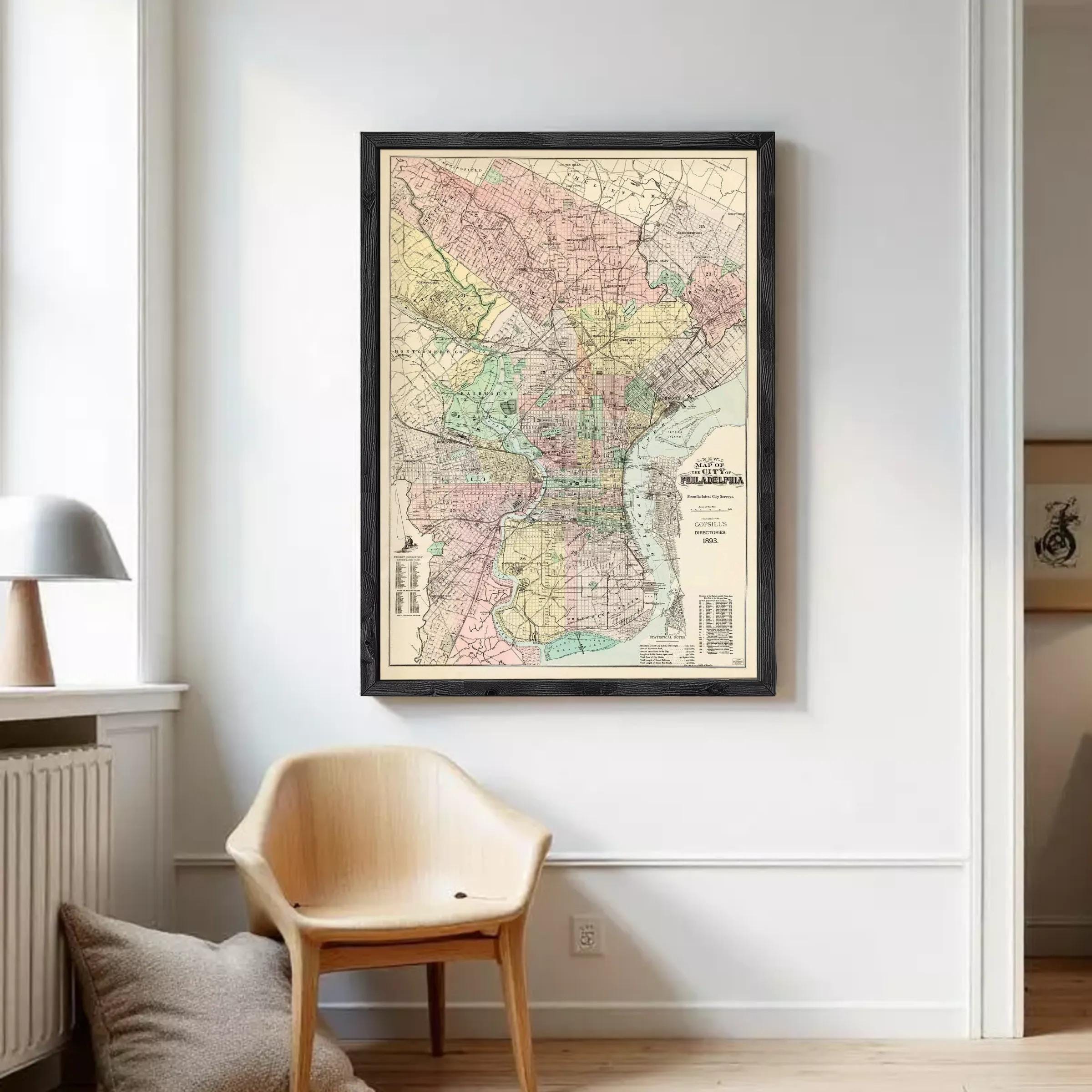 The image is a framed vintage map of Philadelphia, Pennsylvania, depicting the city's streets, neighborhoods, and surrounding areas.