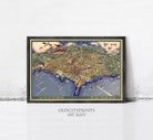 The image is a framed art print depicting a detailed map of a city, with various landmarks and streets clearly visible.