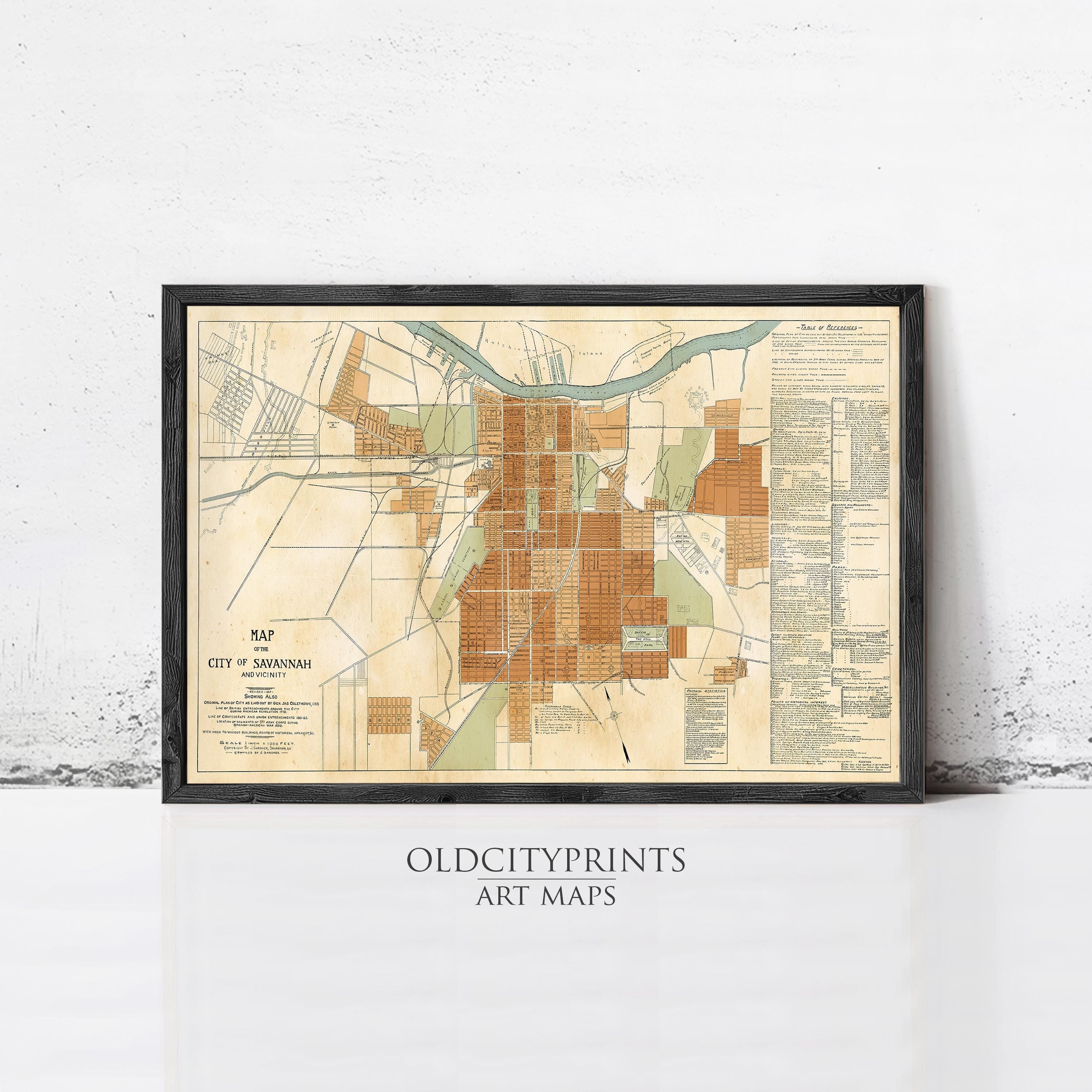 The image is a framed vintage map of the city of Savannah, Georgia, depicting the city's layout and surrounding areas.