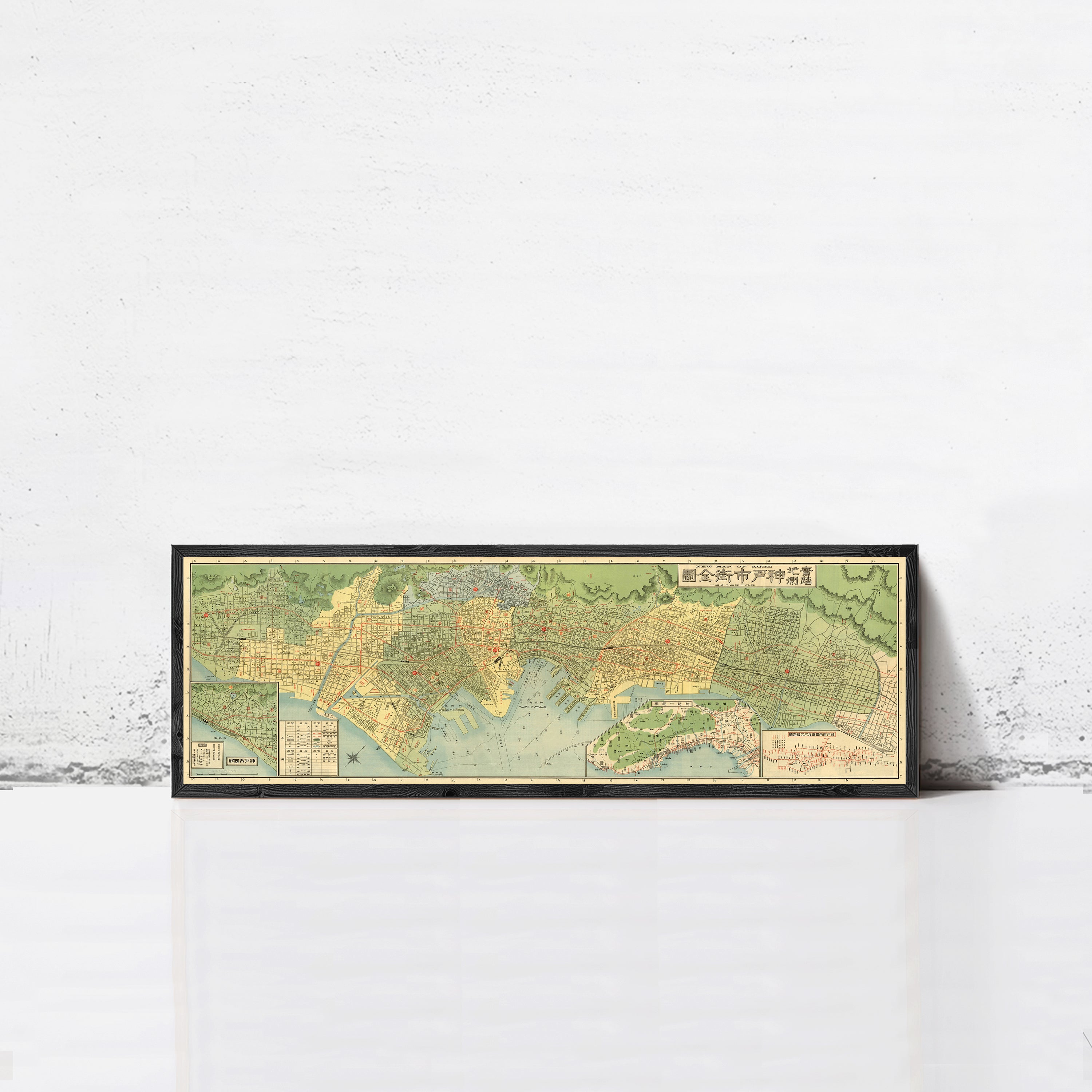 A framed map of a city or region, with various streets and landmarks depicted in a vintage style.