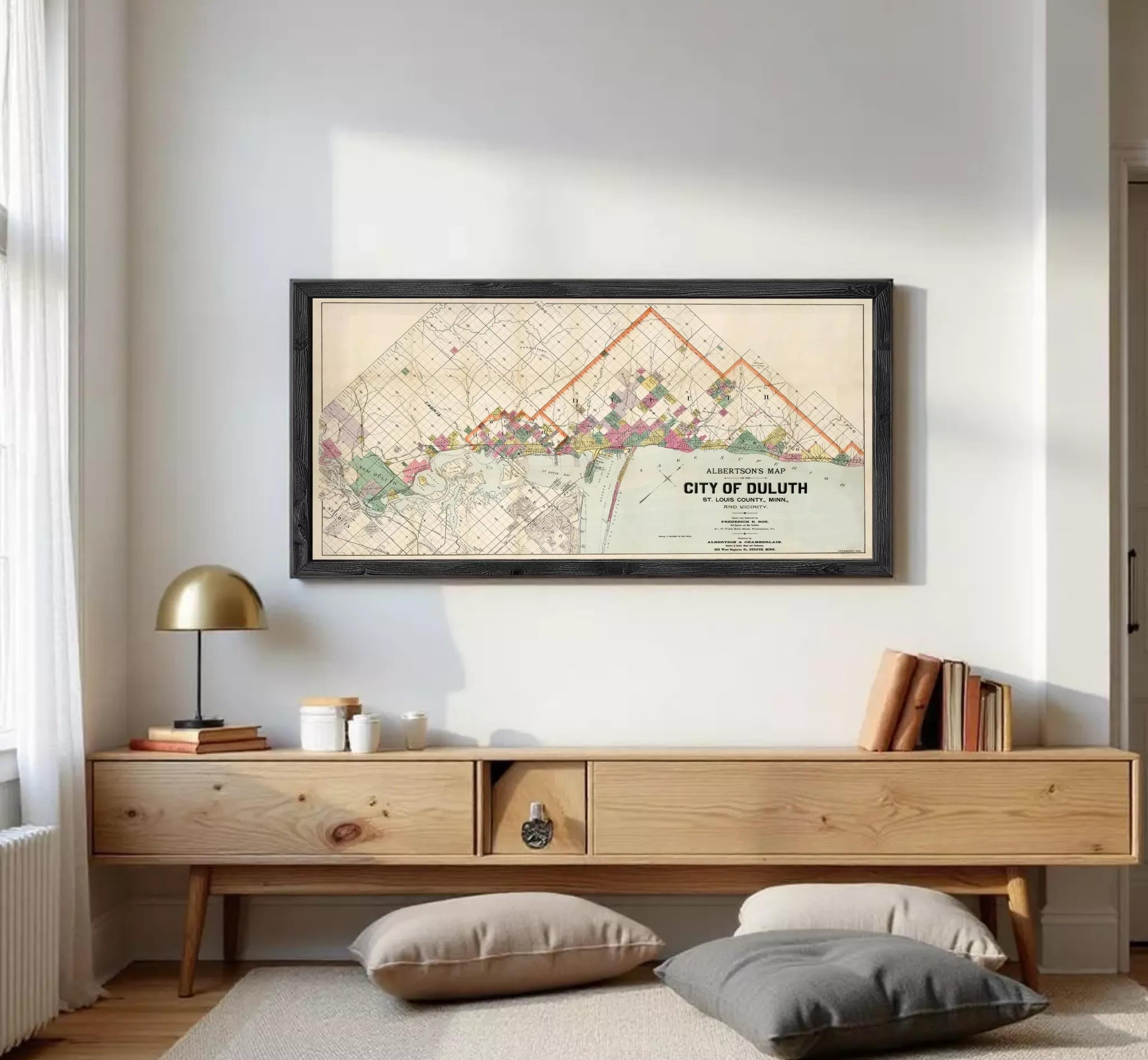 A framed map of the City of Duluth, Minnesota, depicting the city's layout and surrounding areas.