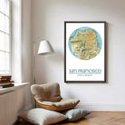 a cozy corner of a room with a large framed map of San Francisco hanging on the wall, a floor lamp, and a comfortable chair.