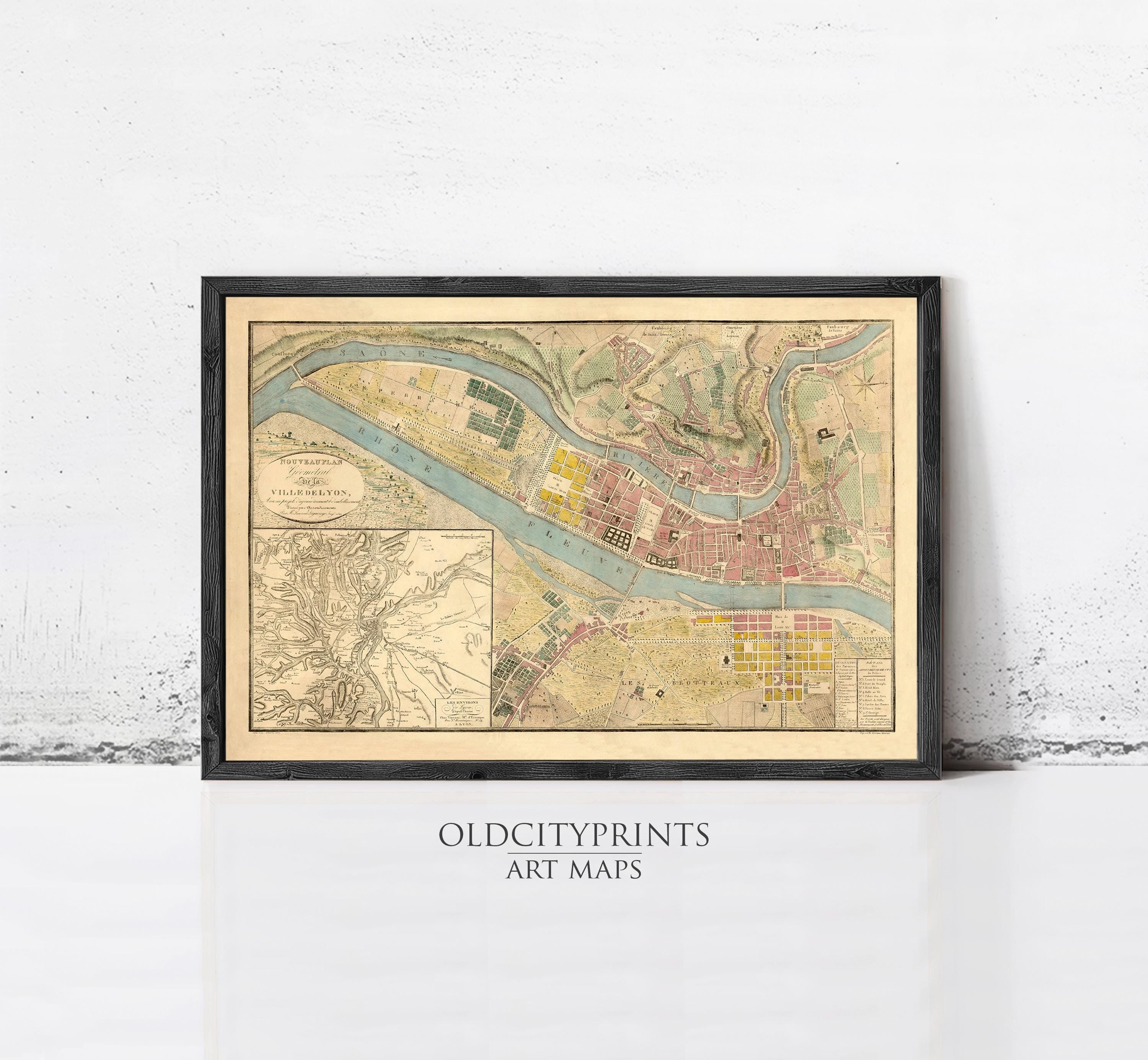 The image is a framed vintage map of a city, likely from the 19th century, with detailed cartography and a color palette of green, yellow, and red.