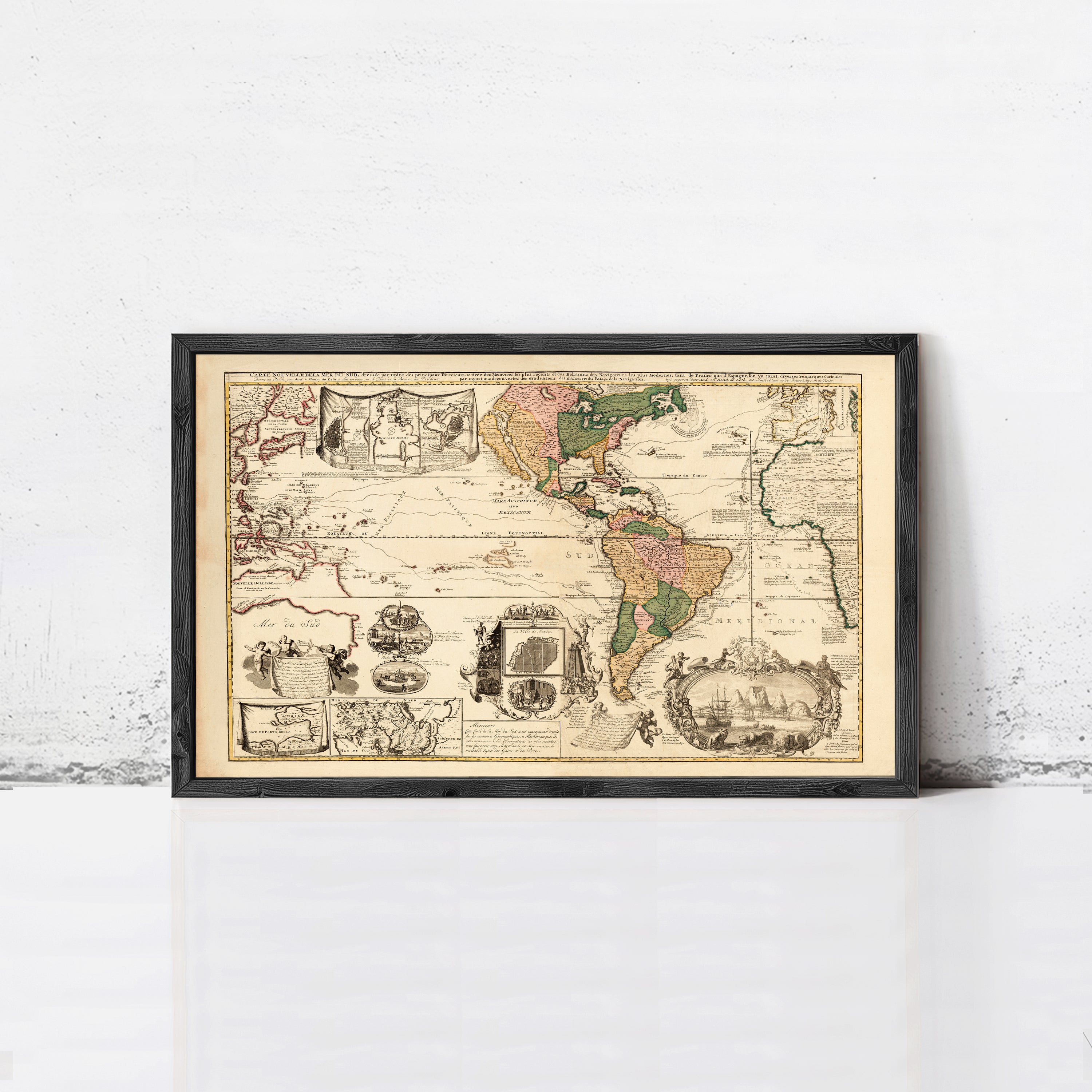 The image is a framed antique map of the world, depicting various regions and countries.