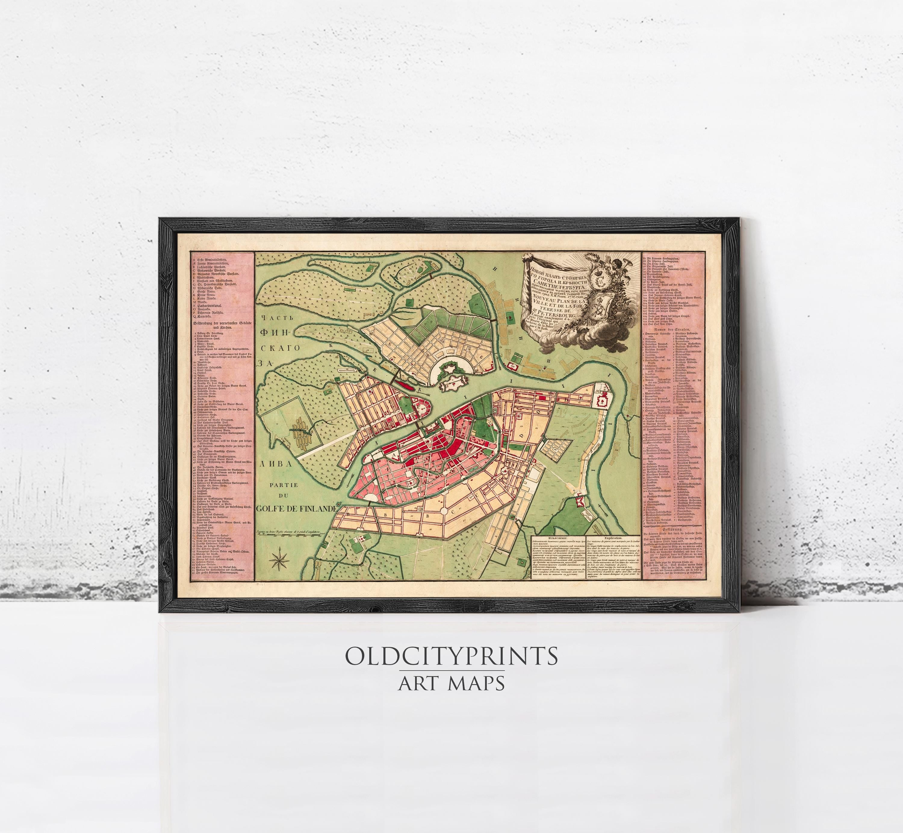 The image is a framed art map of a city, depicting a detailed layout of streets, buildings, and other landmarks.