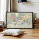 The image is a framed vintage world map depicting the continents and oceans.