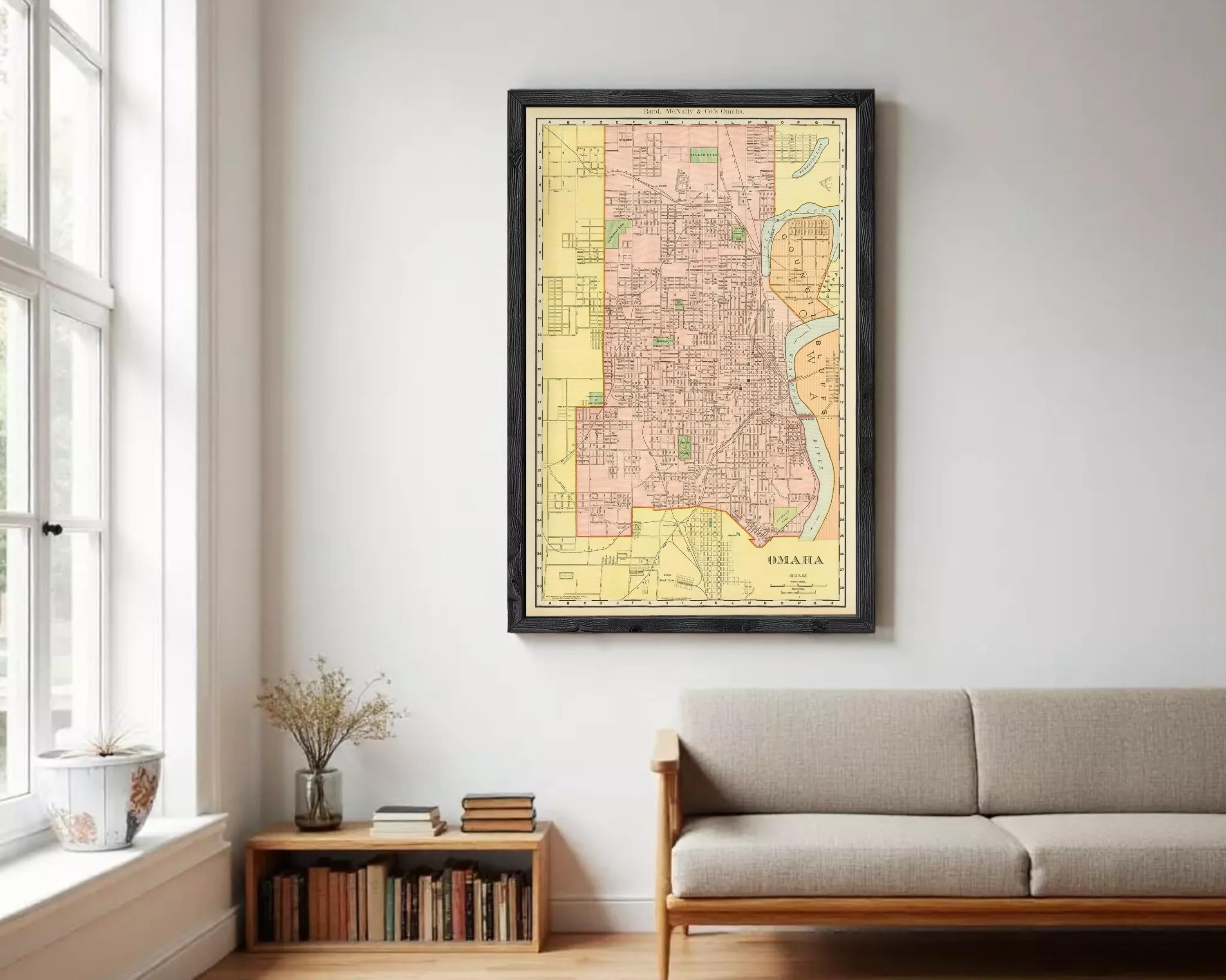 The image is a framed vintage map of Omaha, Nebraska, showing the city's layout and surrounding areas.