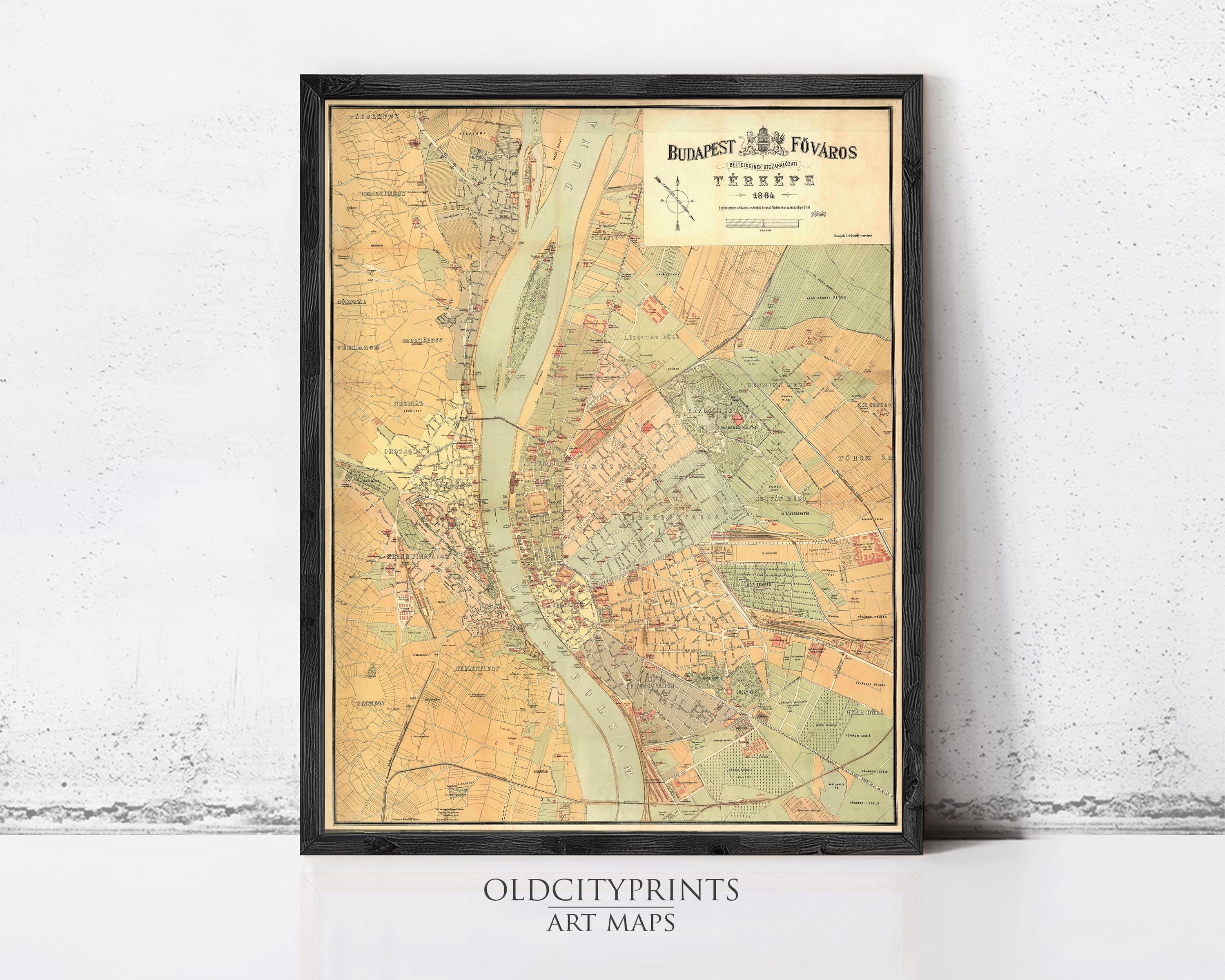 The image is a framed vintage map of Budapest, Hungary, depicting the city's streets and surrounding areas.