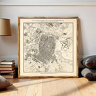The image is a framed map of a city, depicting various landmarks and streets.