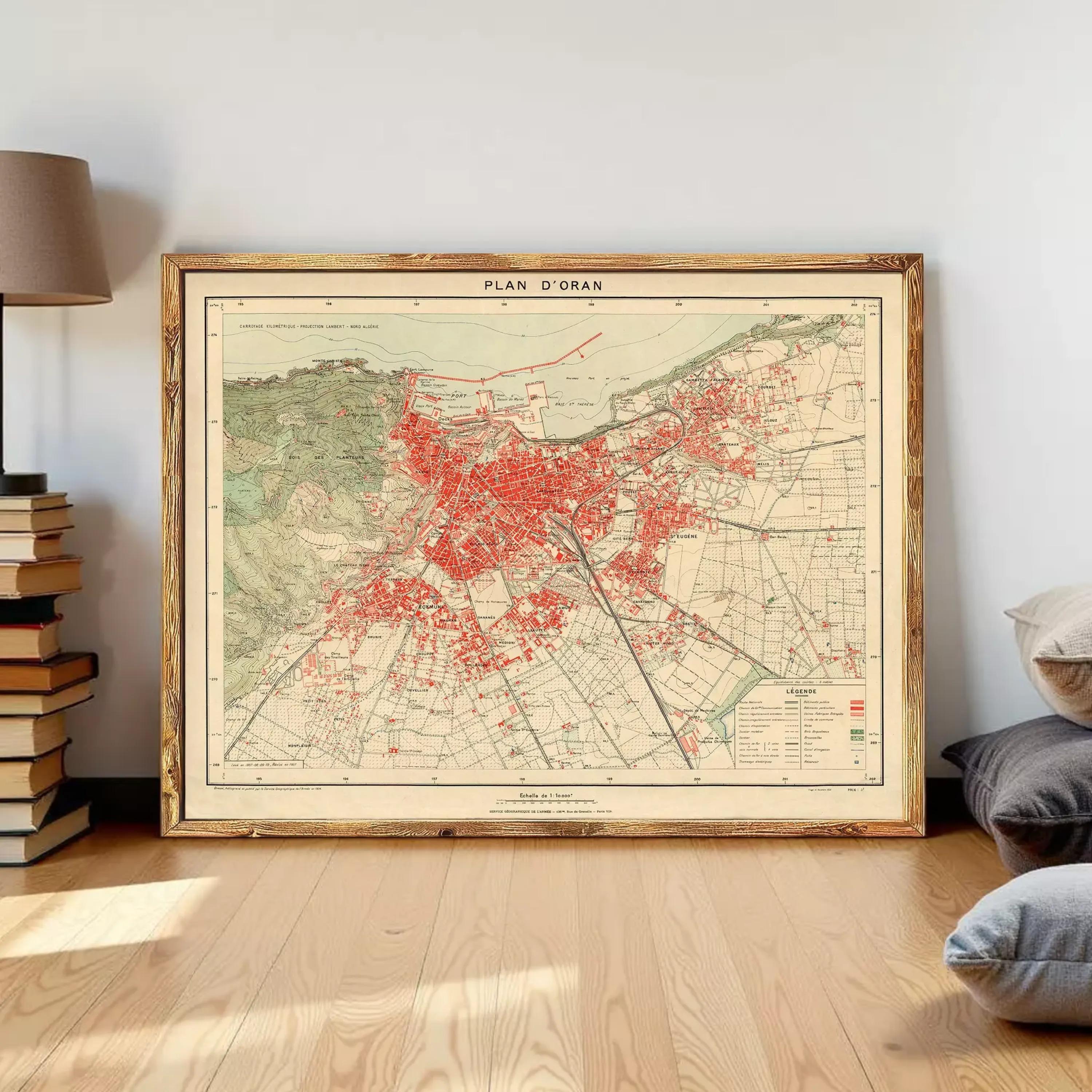 The image is a framed vintage map of a city, with a red-colored area highlighted and labeled as "Plan d'Oran".