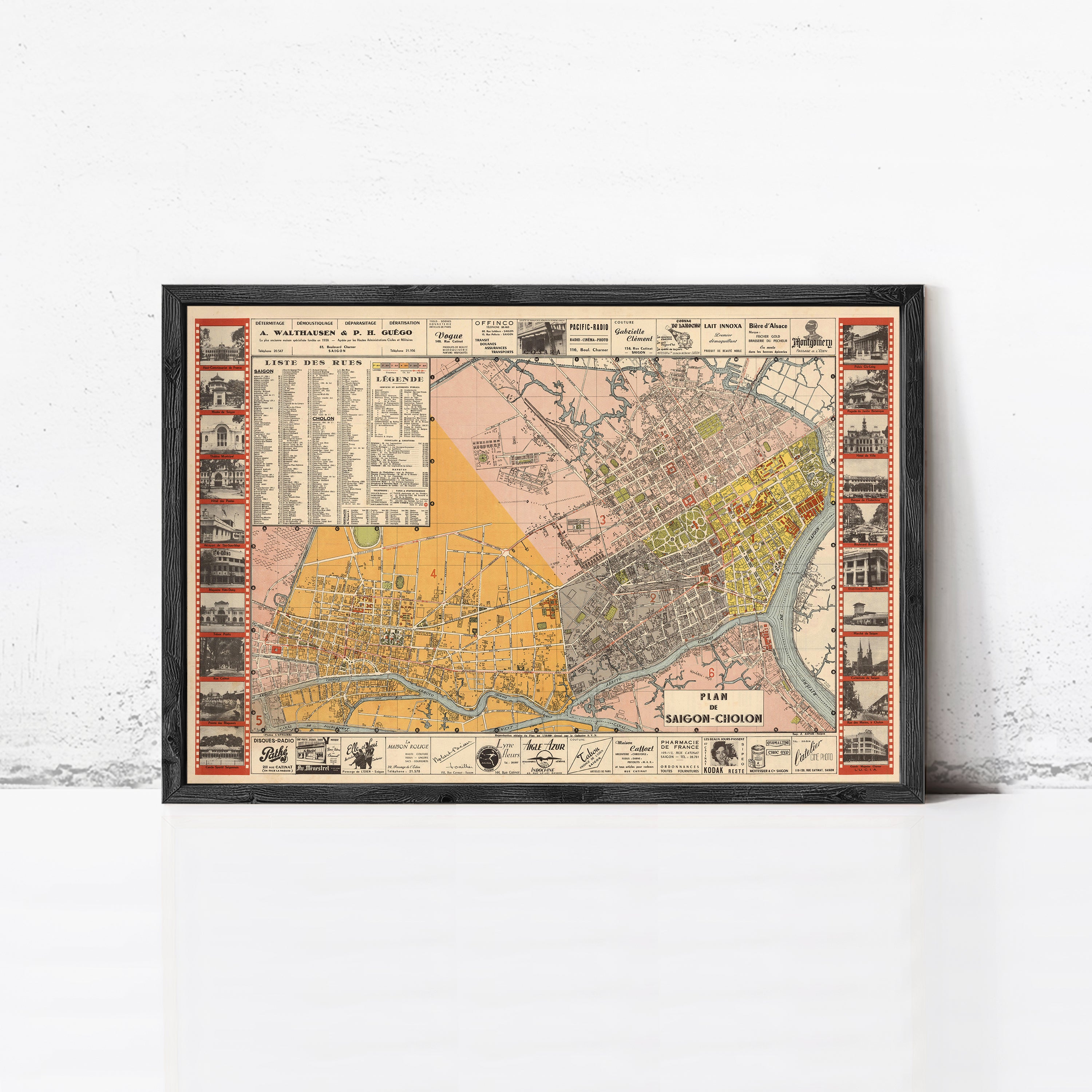 The image is a framed vintage map of a city, likely Paris, with various landmarks and streets depicted.