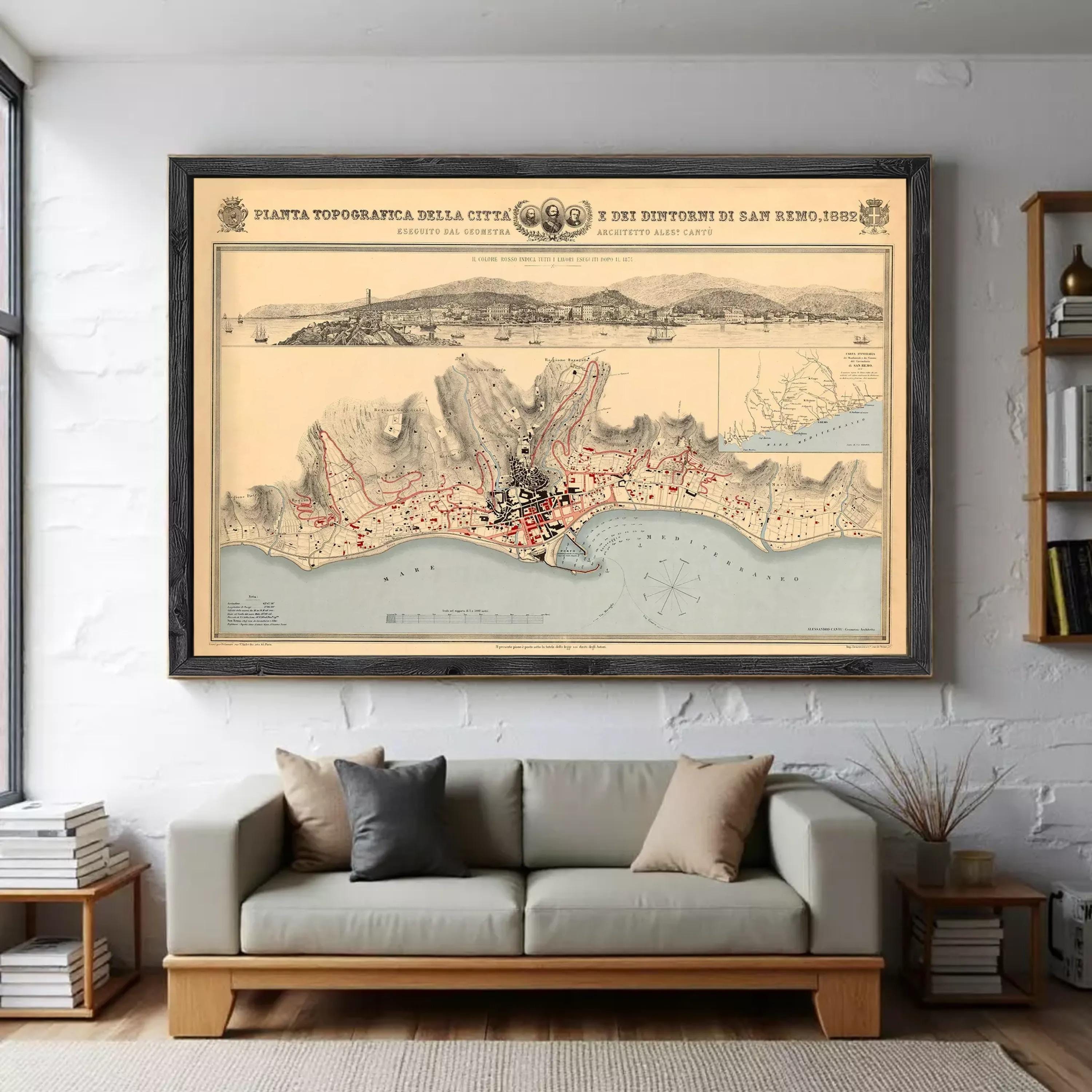 a large framed map of a city hanging on a wall above a couch in a living room.