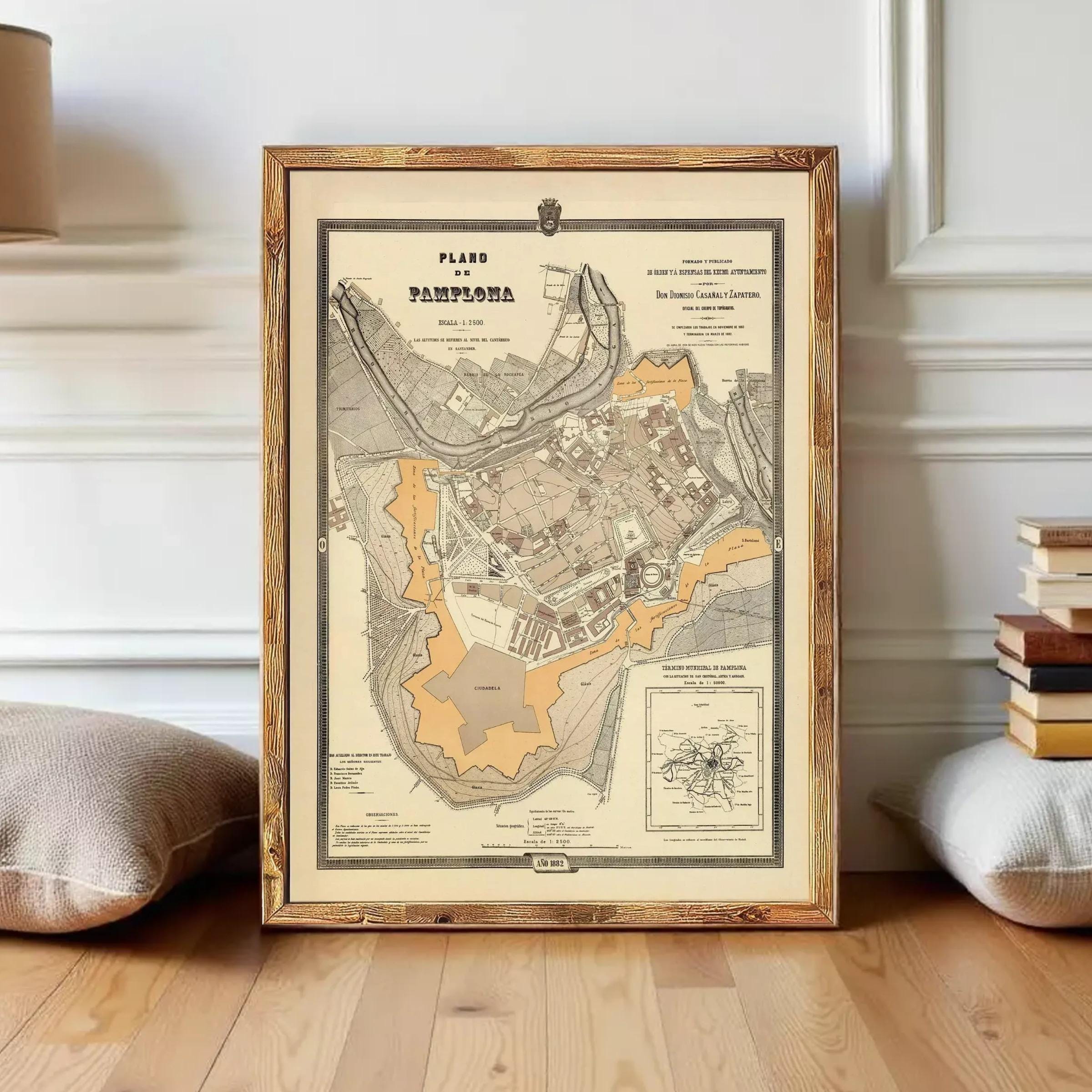 The image is a framed map of the city of Pamplona, Spain, depicting the layout and surrounding areas.