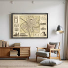 The image is a framed vintage map of a city, featuring various architectural landmarks and buildings.