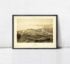 The image is a framed vintage map of a city, depicting a detailed view of the landscape and surrounding areas.