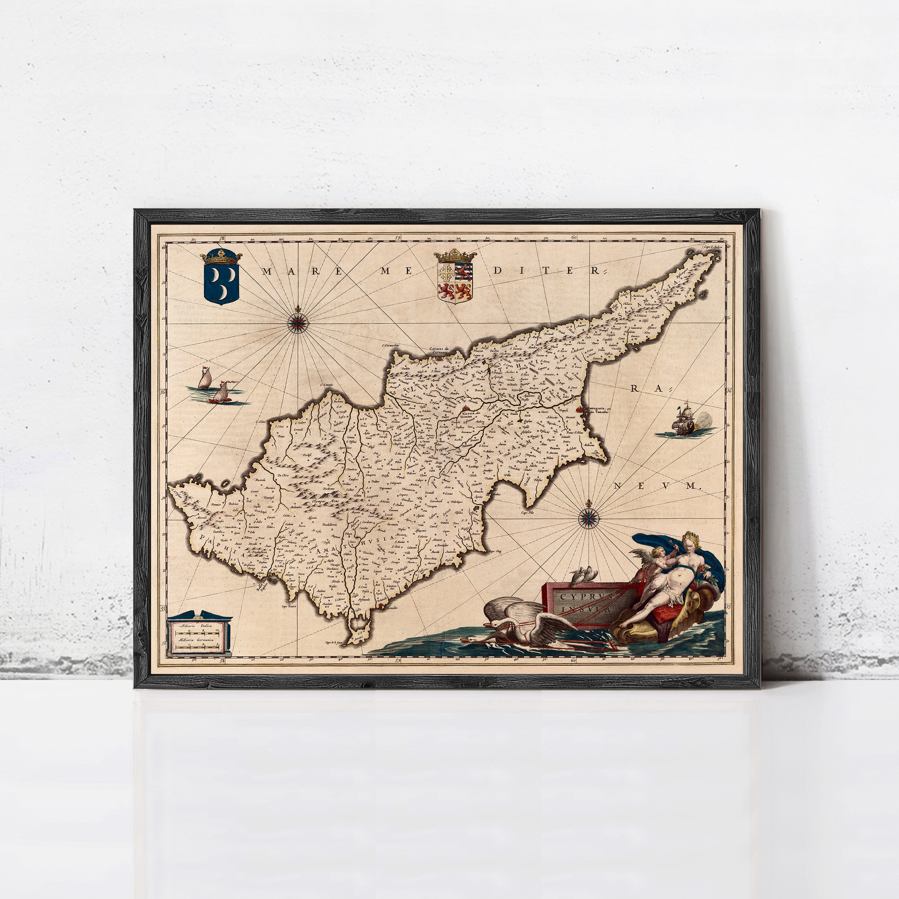 The image is a framed map of the island of Cyprus, depicting various landmarks and geographical features.