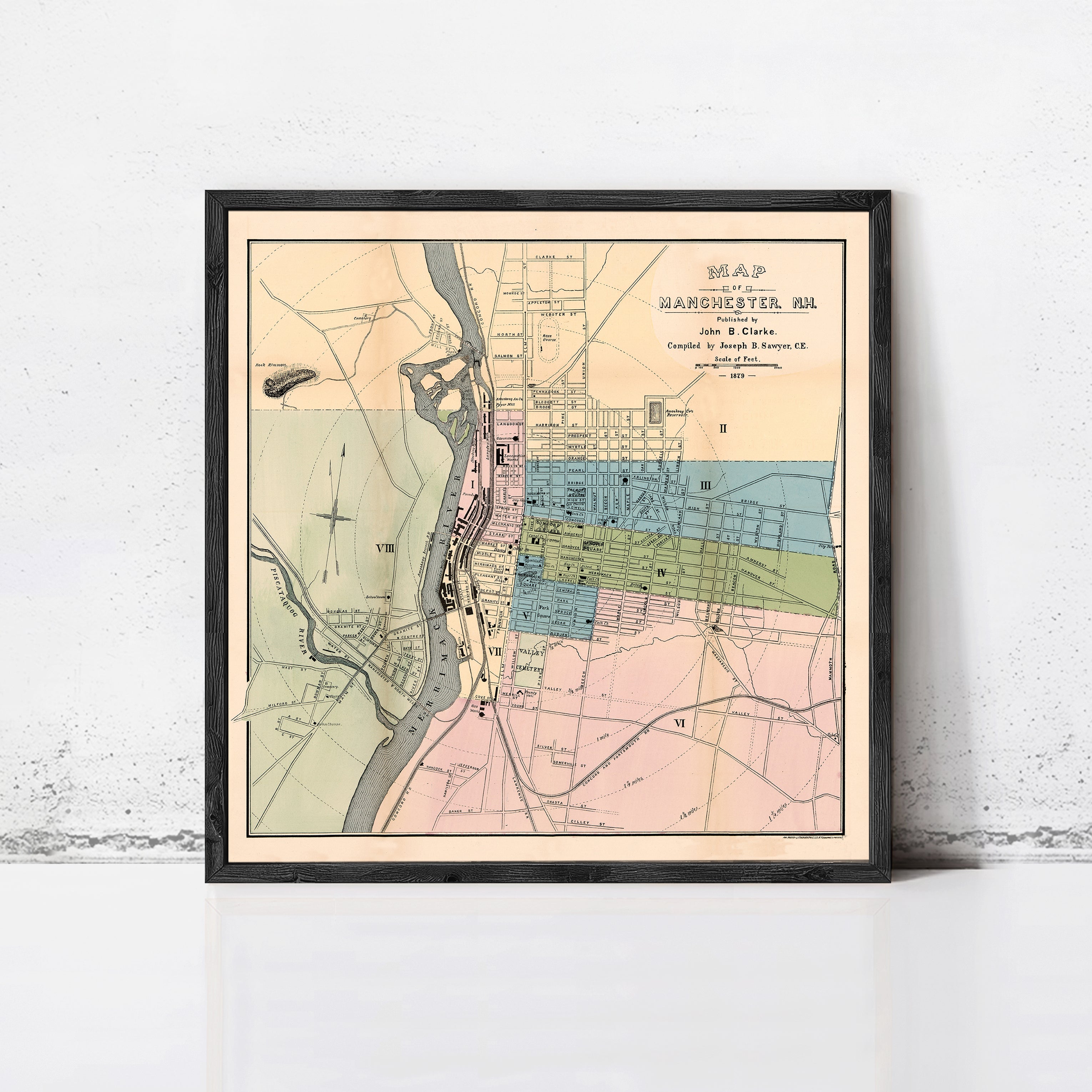 The image is a framed vintage map of Manchester, New Hampshire, showing the layout of the city and surrounding areas.