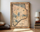 The image is a framed map of New York City, depicting the city's streets and neighborhoods.