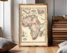 The image is a framed vintage map of Africa, depicting the continent in a detailed and colorful manner.