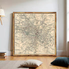 The image is a framed vintage map of Glasgow, Scotland, depicting the city's streets and landmarks in a detailed and intricate manner.