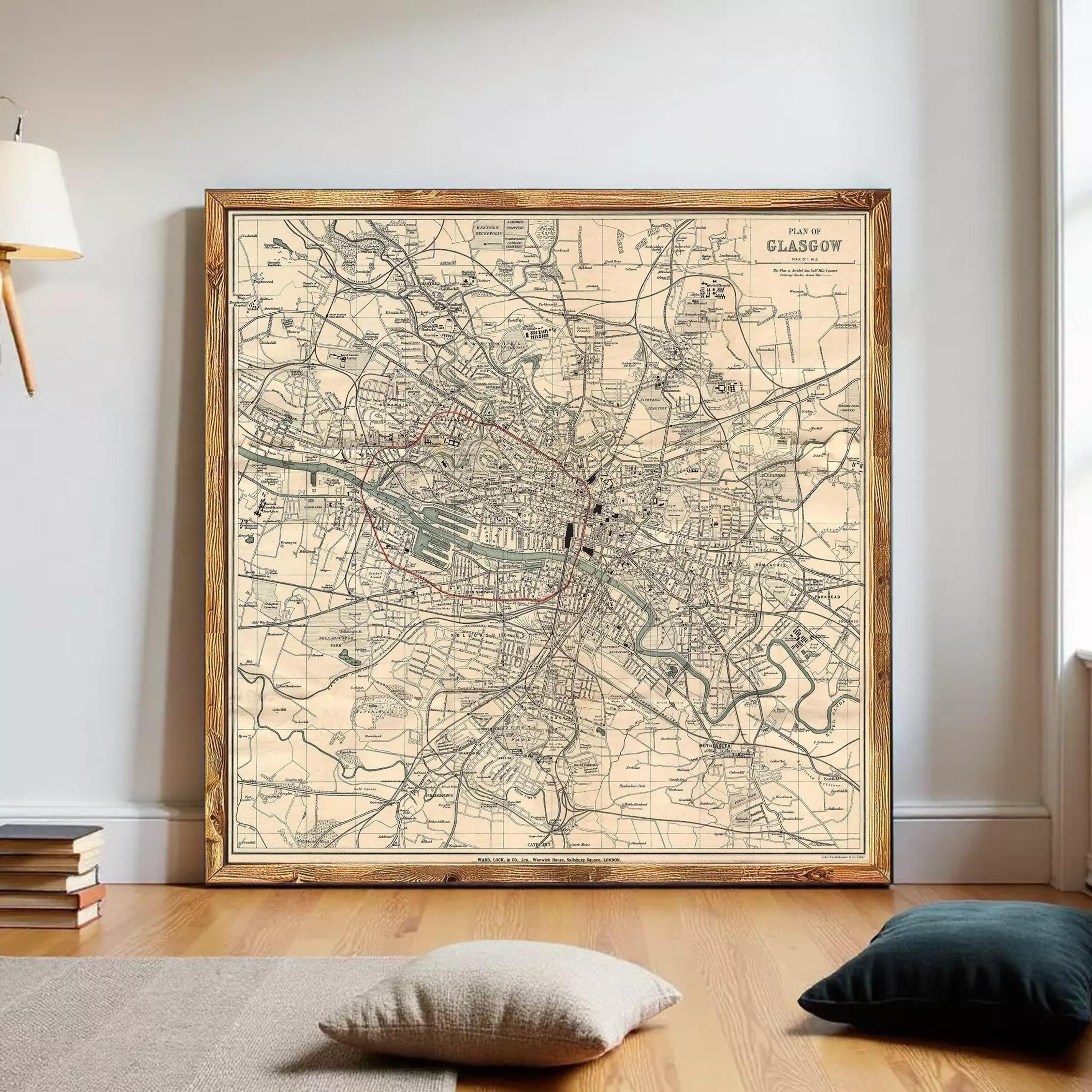 The image is a framed vintage map of Glasgow, Scotland, depicting the city's streets and landmarks in a detailed and intricate manner.