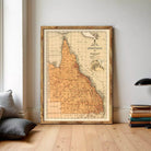 The image is a framed vintage map of the Queensland region of Australia, depicting the state's geographical layout and boundaries.