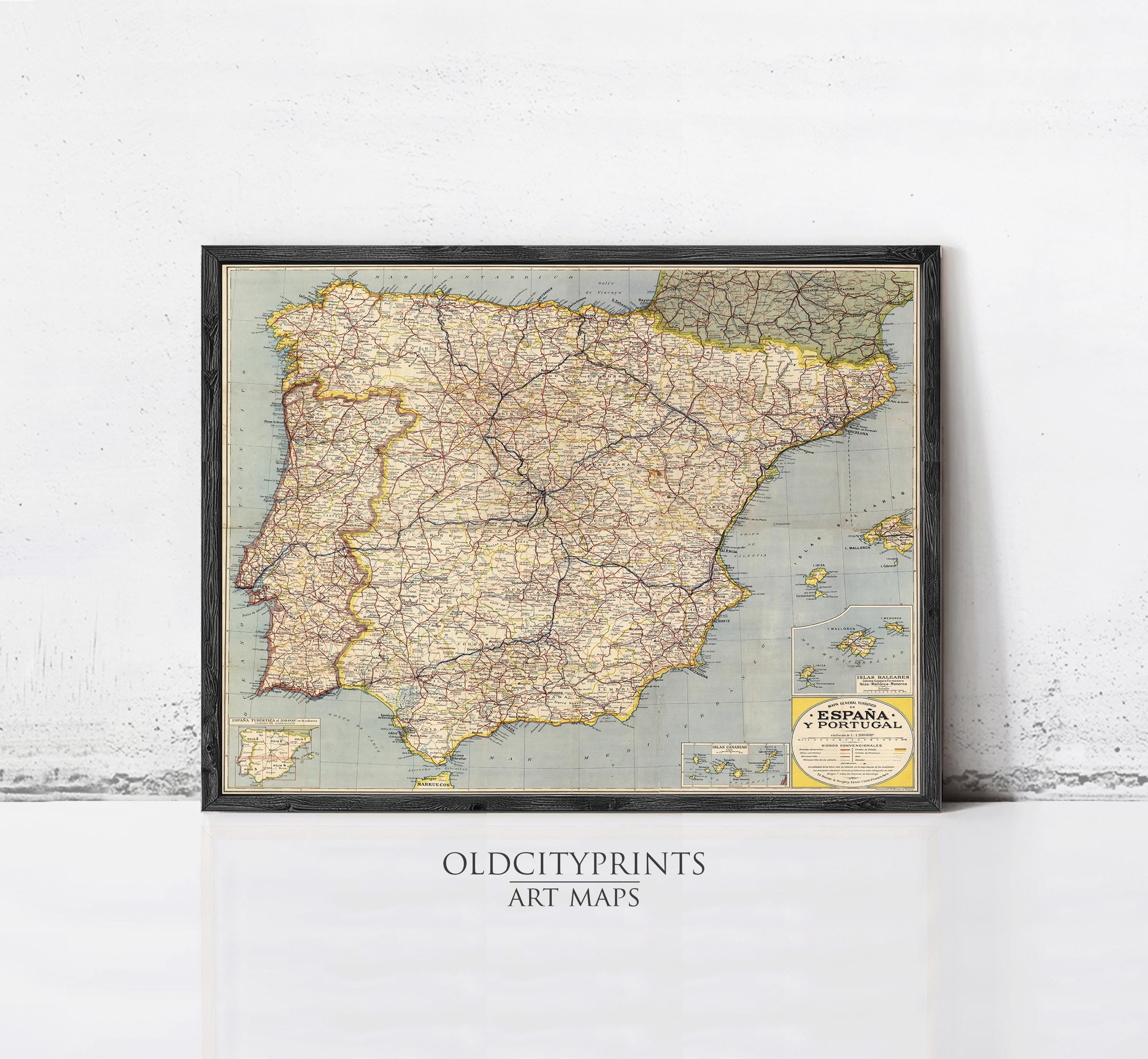 The image is a framed vintage map of Spain and Portugal, with a black border and a yellow label indicating it is an art print.