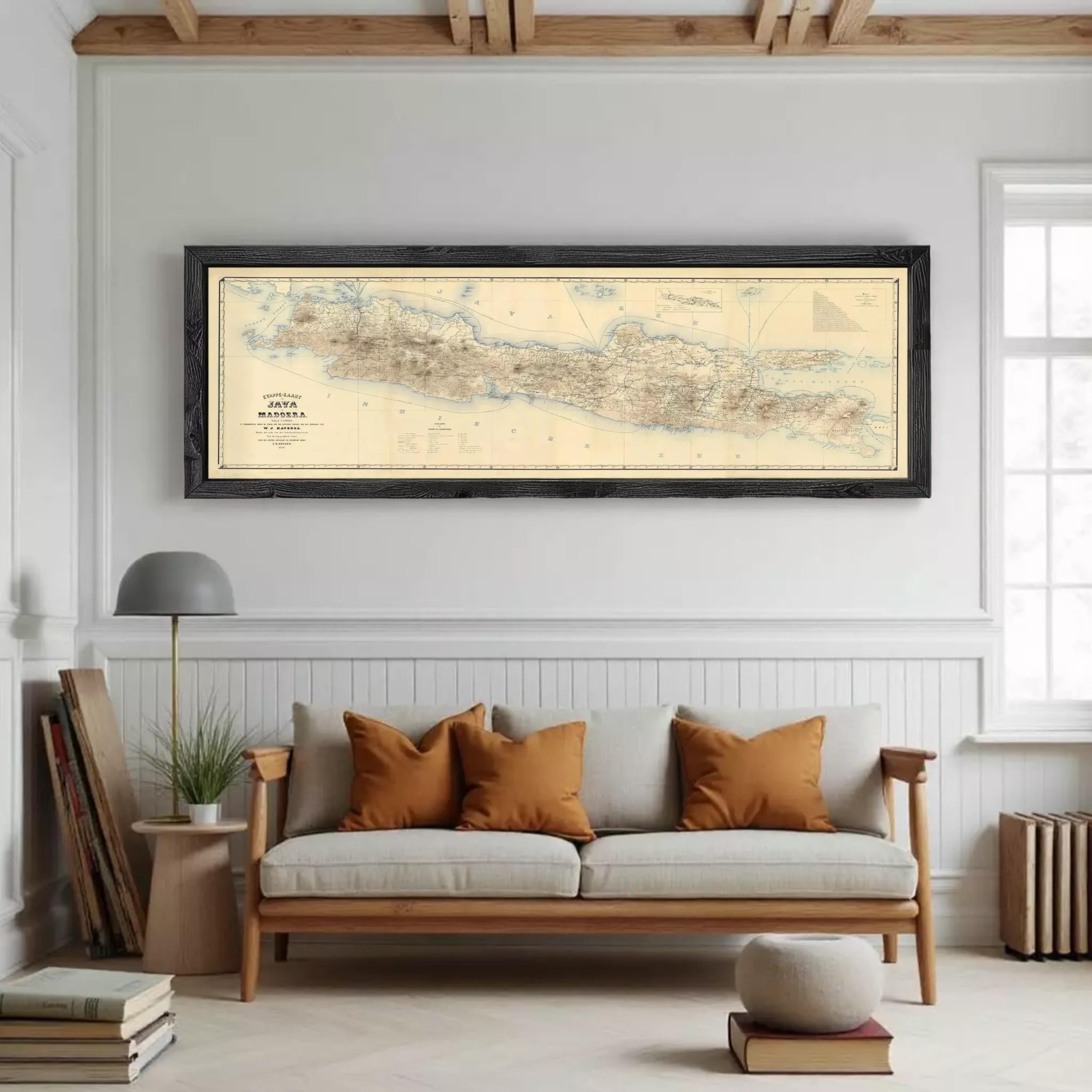 A framed map of Madagascar, a country in the South Pacific, is displayed against a white wall.